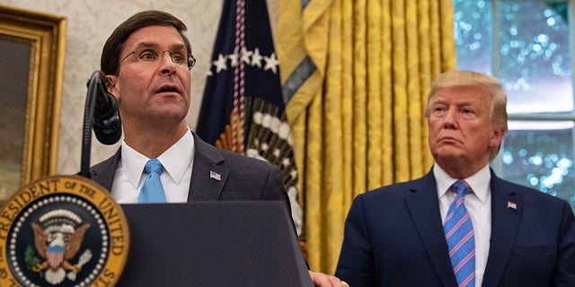 US Defense Secretary Mark Esper speaks after being sworn in as President Trump watches in the Oval Office at the White House in Washington, DC, July 23, 2019. 